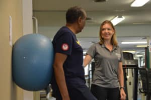 Physical Therapist works with patient.